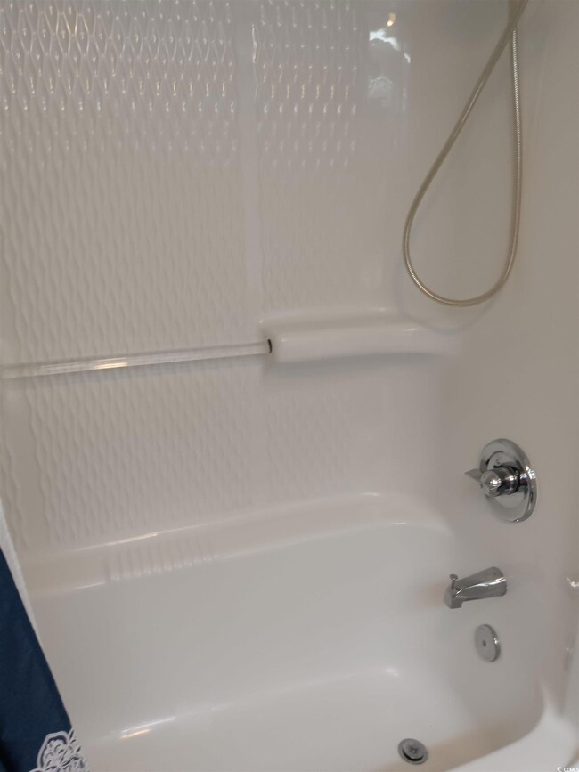 Full bathroom with tub / shower combination