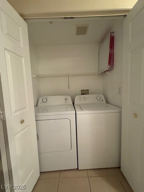 Washroom featuring independent washer and dryer an