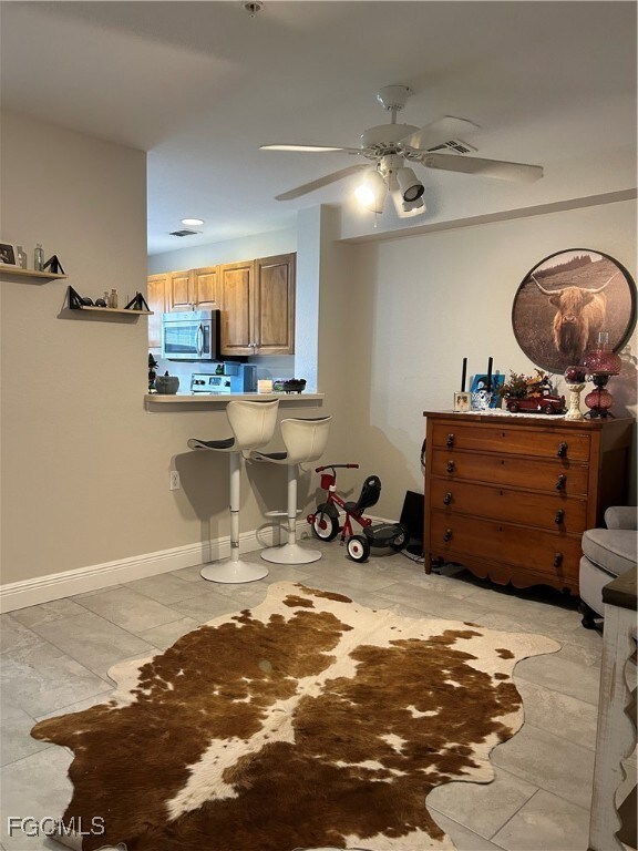 This is a dining room, but owner is using a sitting area. Breakfast bar overlooking the kitchen area.