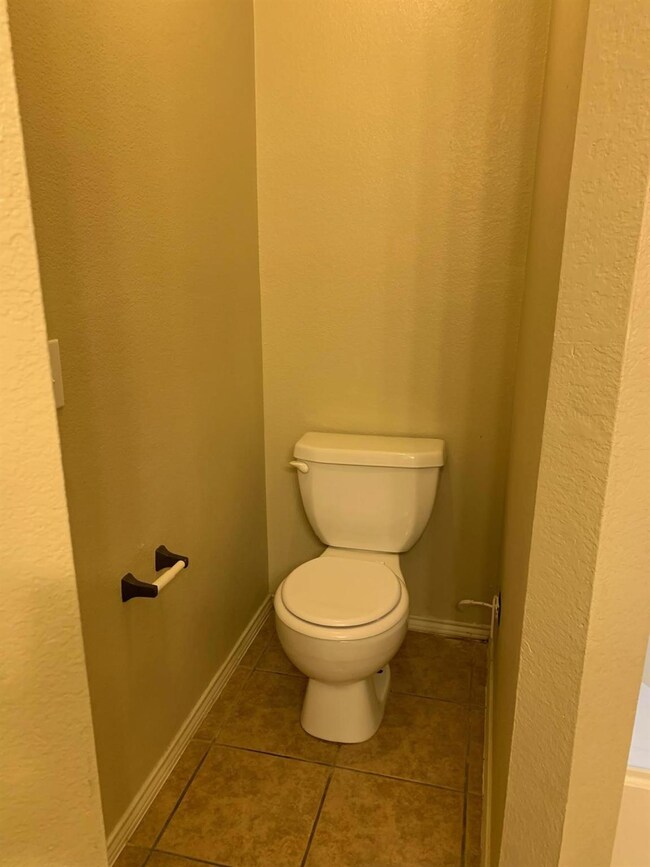 Bathroom with tile floors and toilet