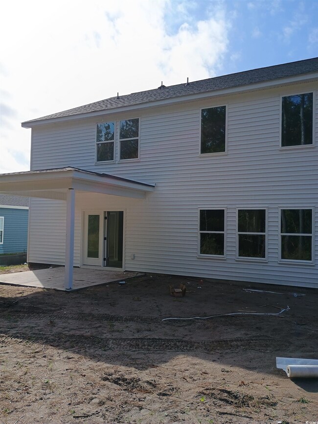 Rear view of property with a patio area