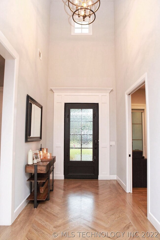 Gorgeous herringbone patterned wood floors in entr