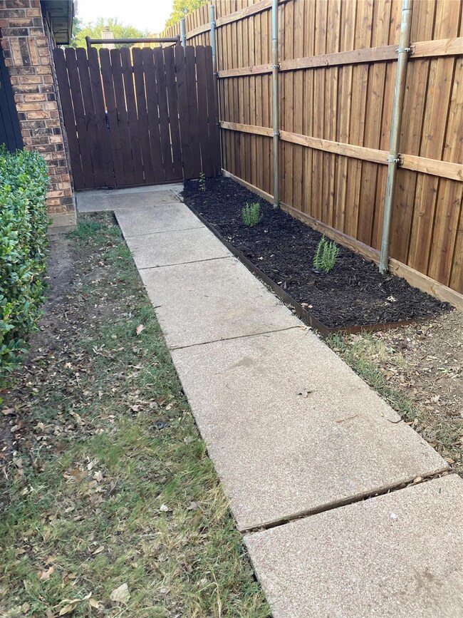 New 8 ft fence on east side of house near entryway