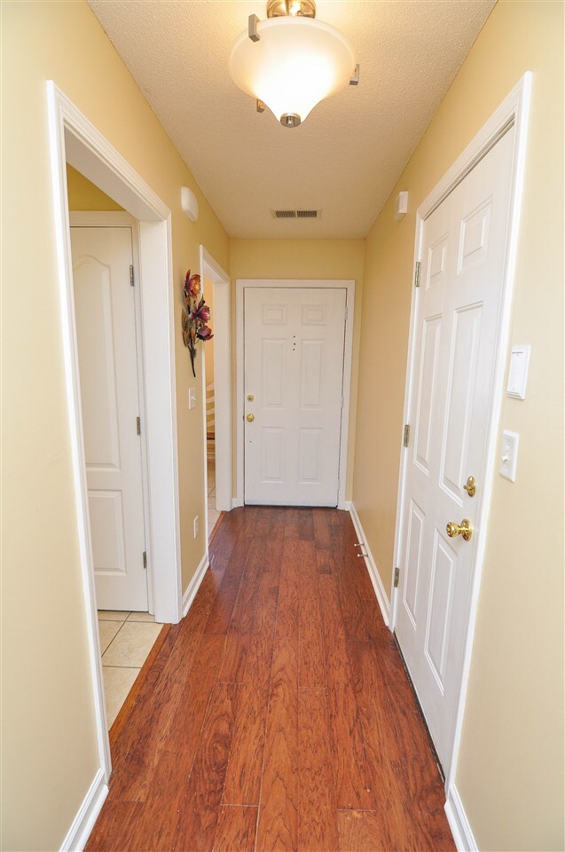 Step inside the entry and be greeted by wood lamin