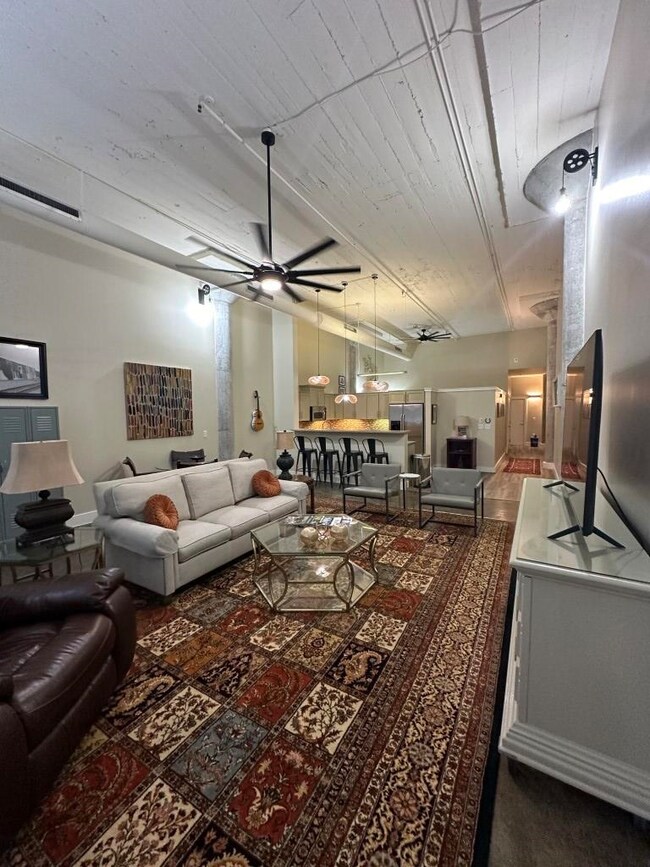 Living room featuring ceiling fan