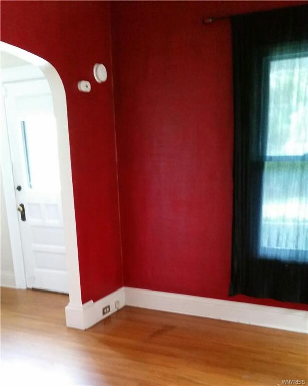Living room (lower unit) showing hardwood floors, 
