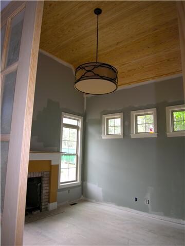 Large study with 8' French doors, vaulted ceiling, side transoms, & a fireplace!  This home has 2 fireplaces.