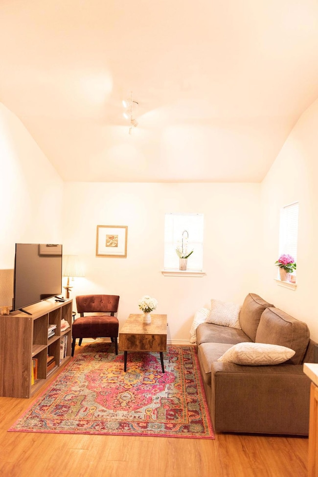 Living area featuring wood finished floors and va
