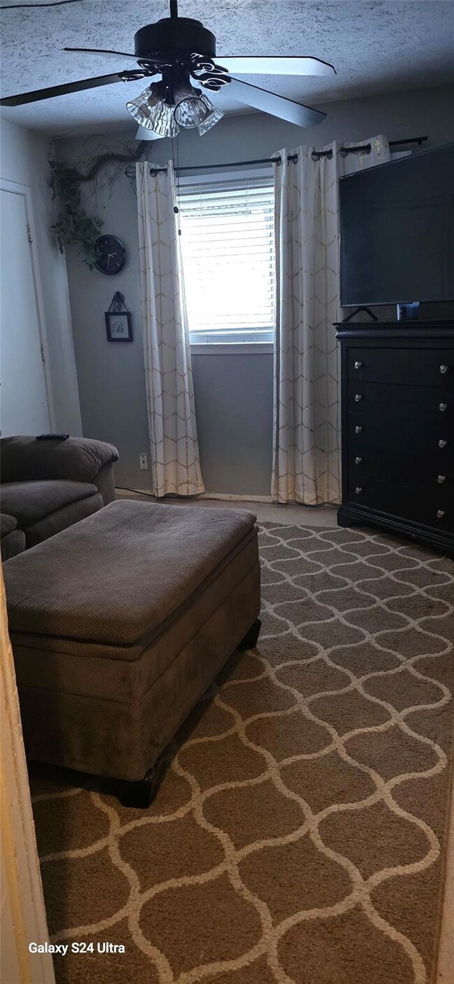 Sitting room featuring a textured ceiling and ceil