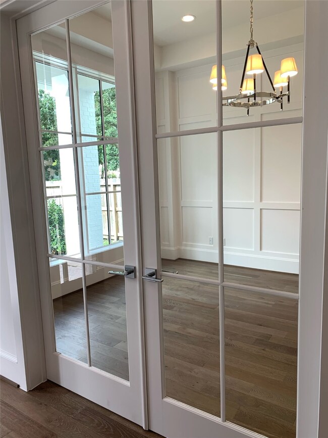 French doors to the study add charm as well as pri