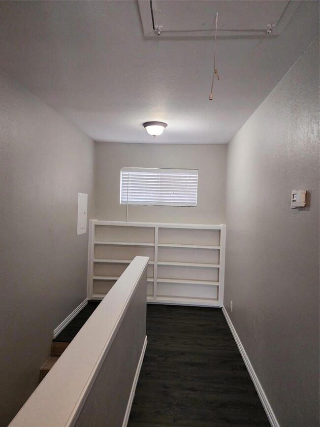 Upstairs hall with storage & attic access