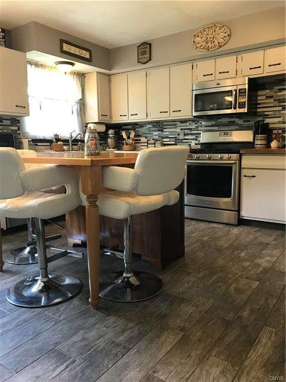 Cheery Kitchen with plenty of cupboards and counte