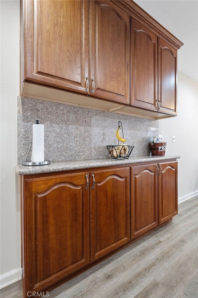 Appliance shelf and additional cabinets.