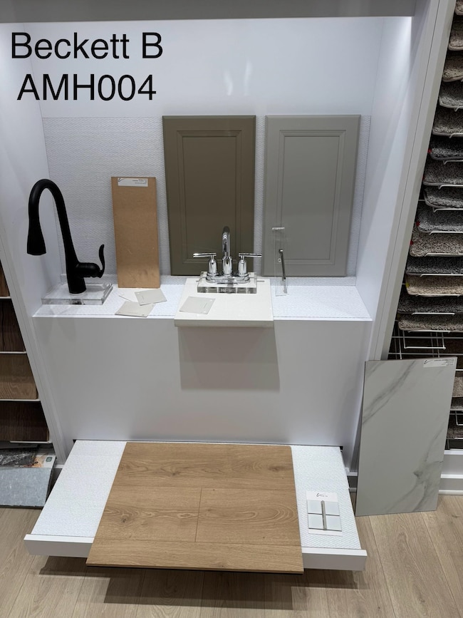 Bathroom with wood finished floors and a sink