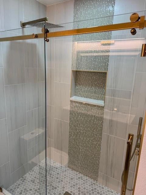 Full bathroom featuring a stall shower