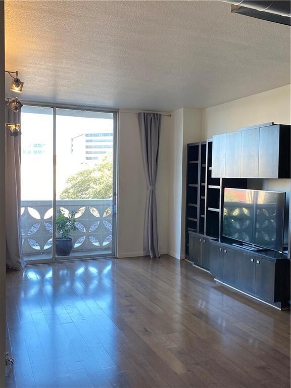 Unfurnished living room with a textured ceiling, 