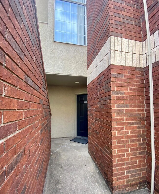 Doorway to Unit 108.  Adjacent stairway to undergr
