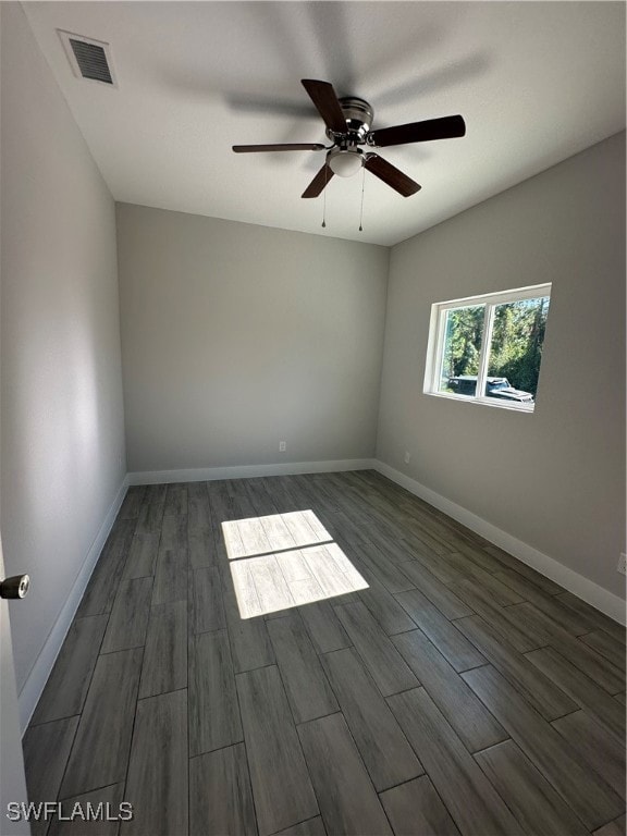 Spare room with hardwood / wood-style flooring and