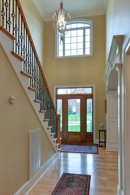 foyer with high ceilings and beautiful wood door