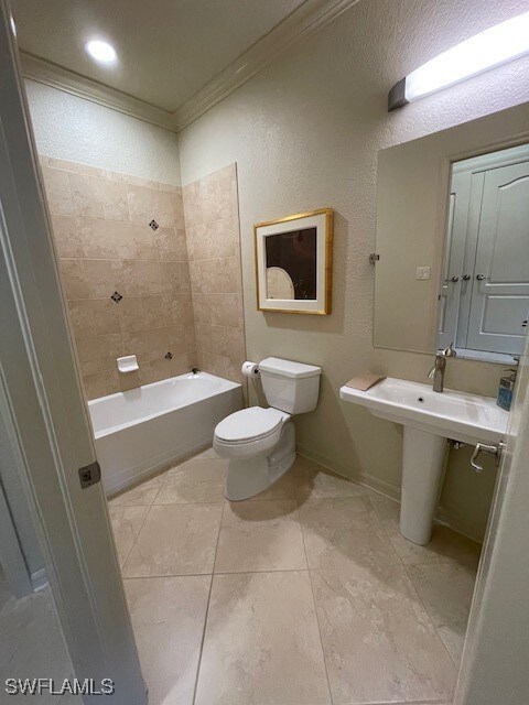 Bathroom with tile patterned flooring, toilet, orn