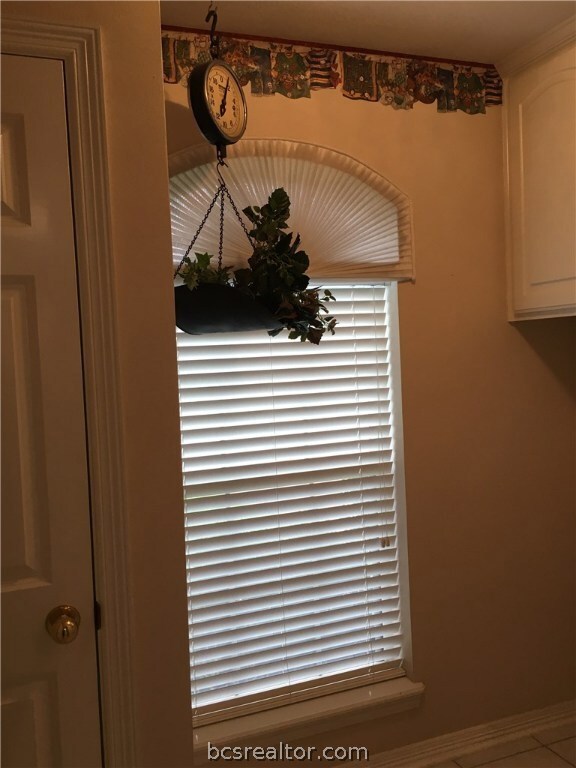 View of the laundry room with closet, washer, drye