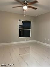Unfurnished room featuring baseboards and ceiling