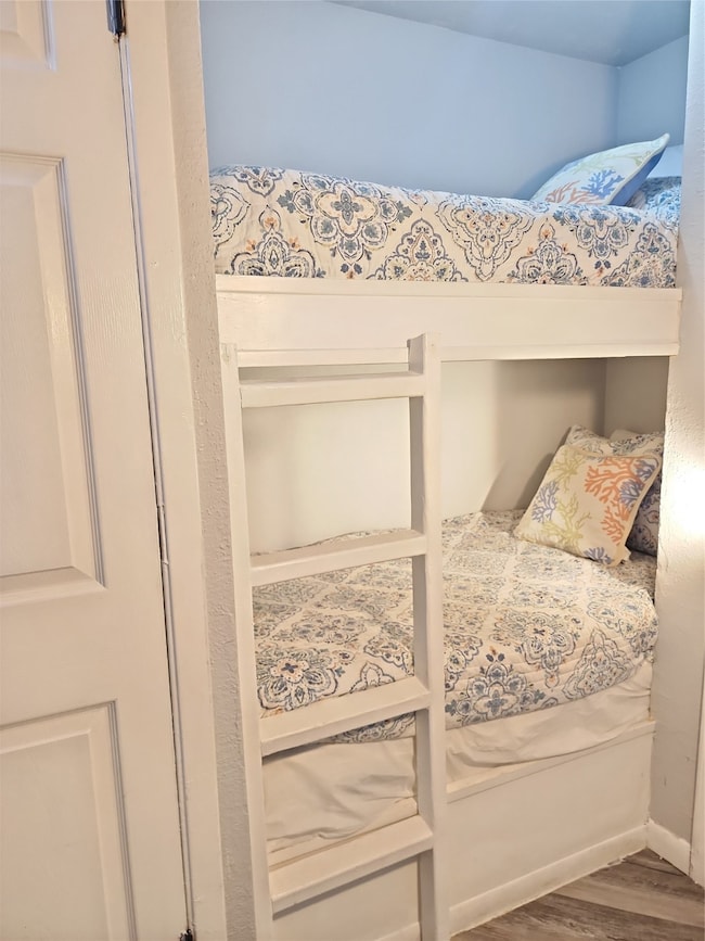 Cozy bedroom with a beach-themed decor, featuring