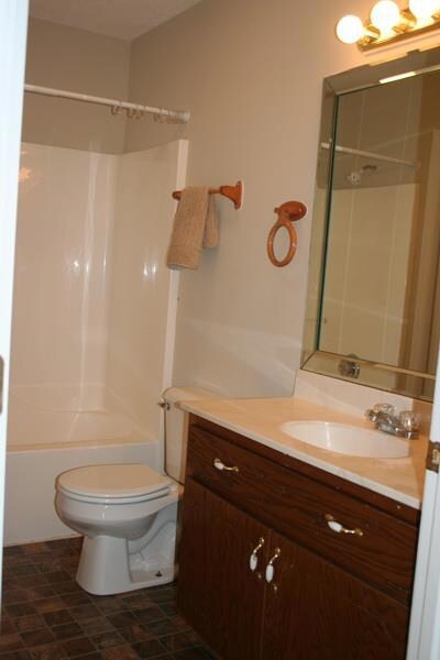 Hall bath with utility to left.