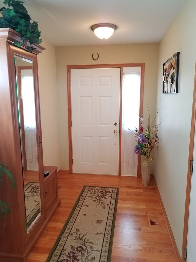 Elegant Foyer with hardwood flooring