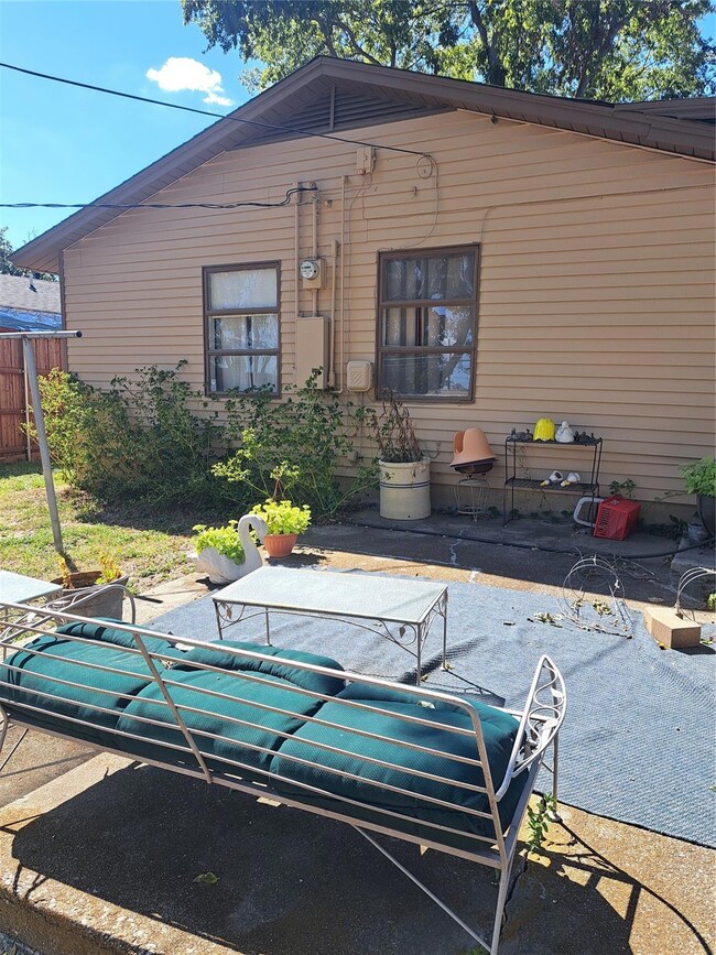 Rear view of property featuring a patio area