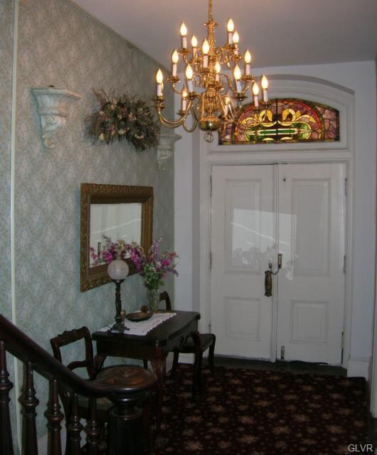 The entrance to this one-of-a-kind home boasts dou