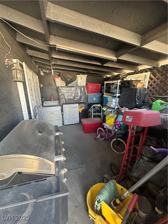 Garage featuring washing machine and dryer