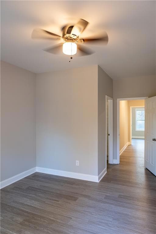 Unfurnished room with a ceiling fan, baseboards, a
