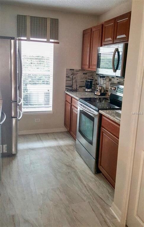 KITCHEN WITH NEW TILE AND BACKSPLASH