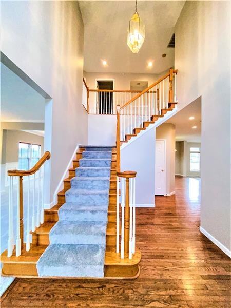 The soaring 2 story 16x12 foyer has hardwood floor
