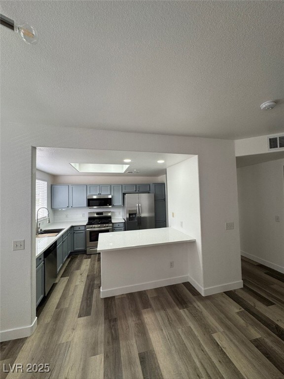 Kitchen with appliances with stainless steel finis