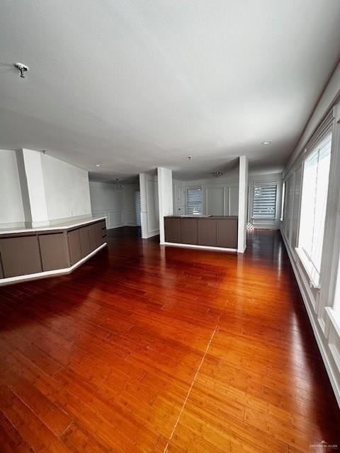 Unfurnished room with dark hardwood / wood-style flooring