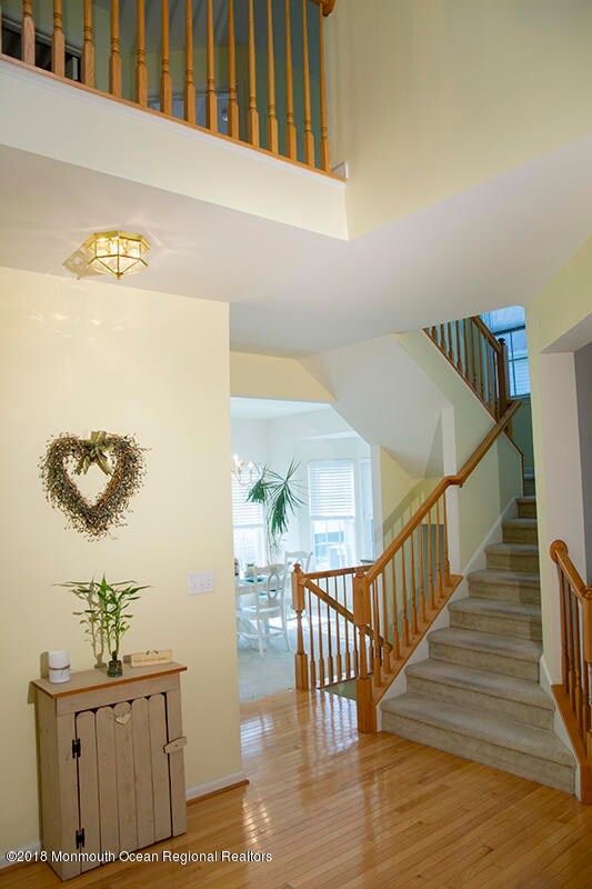 Foyer view of steps and dining room
