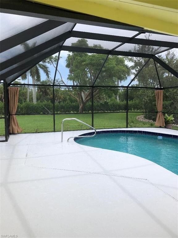 screened in lanai with pool ,custom curtains opene