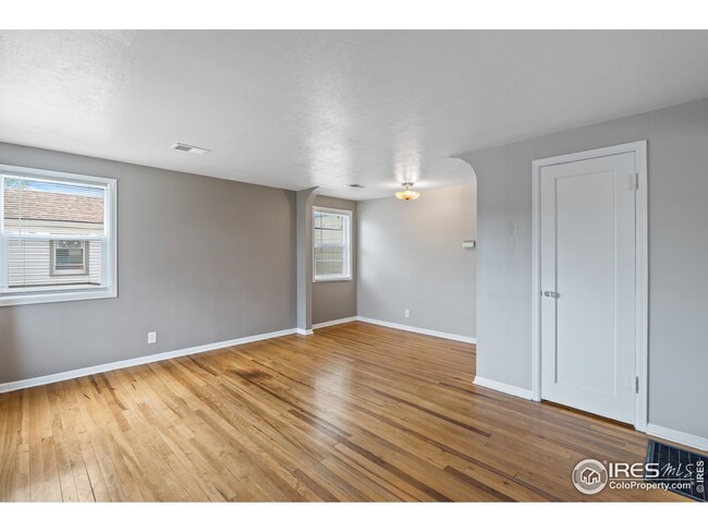Living room with original hardwood floors.
