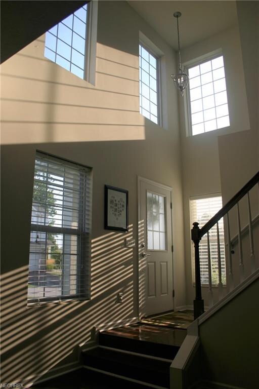 Dramatic and inviting double story foyer with beau