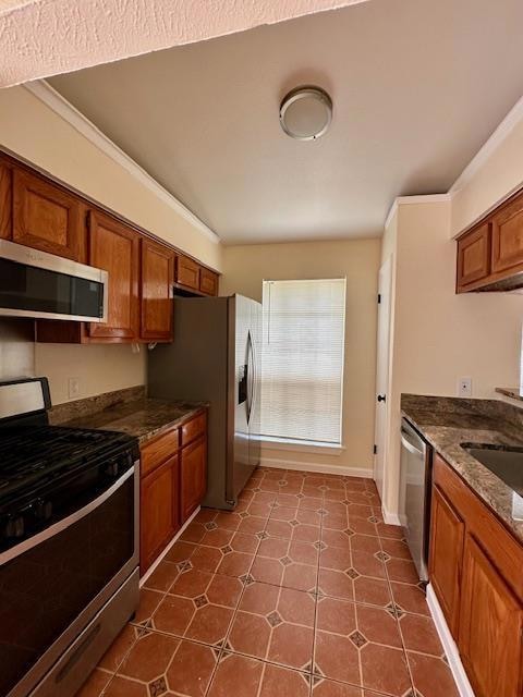 Kitchen with stainless steel appliances, brown ca