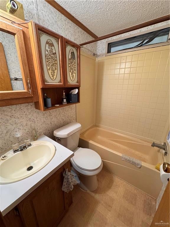 Full bath with bathing tub / shower combination, wallpapered walls, vanity, and a textured ceiling