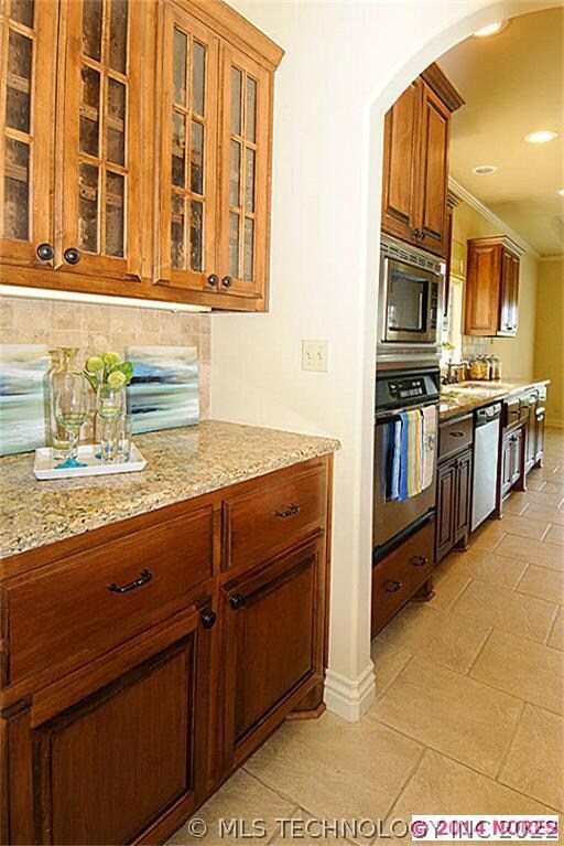 BETWEEN THE DINING & KITCHEN YOU WILL FIND A LARGE