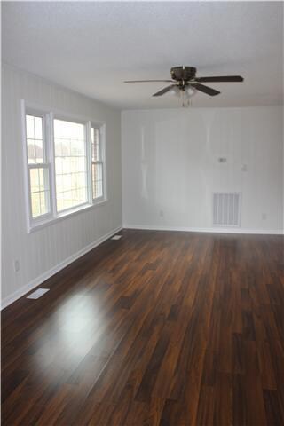 Large living room with a huge picture window.