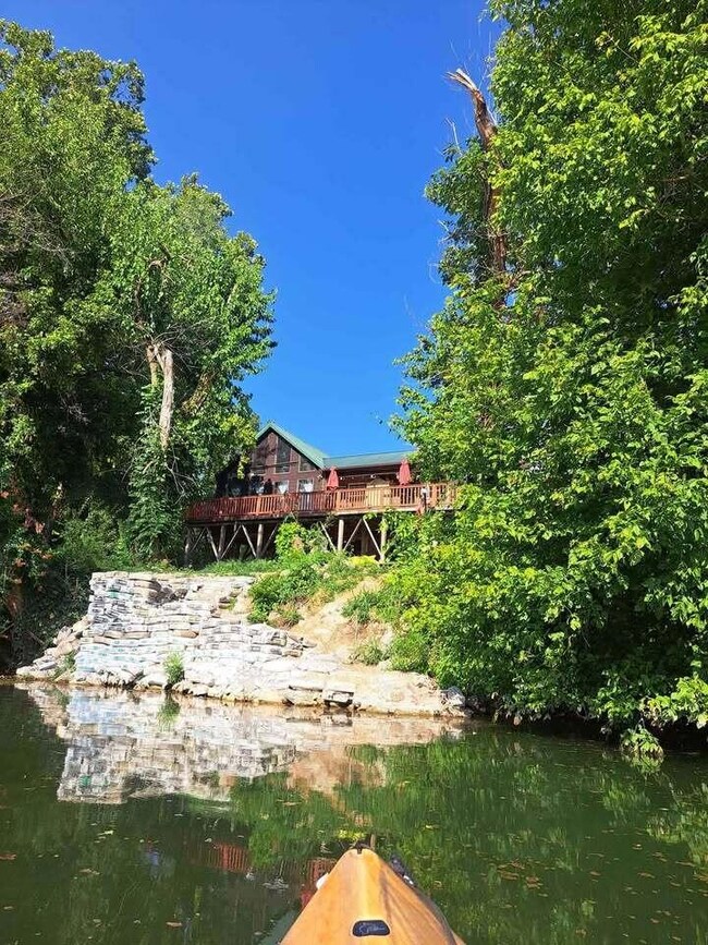 front of cabin in river