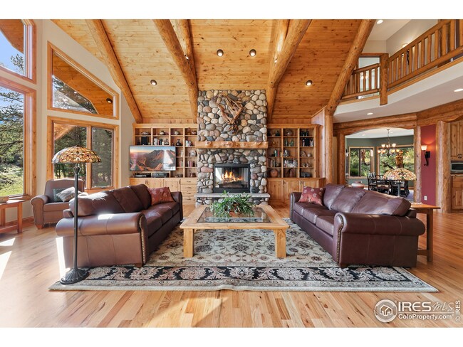 Grand wood burning river rock fireplace