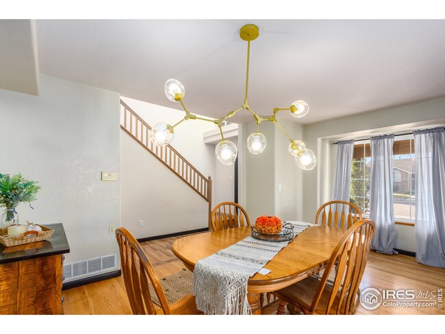 Separate dining room with two big bay windows. Unique lighting that is included!
