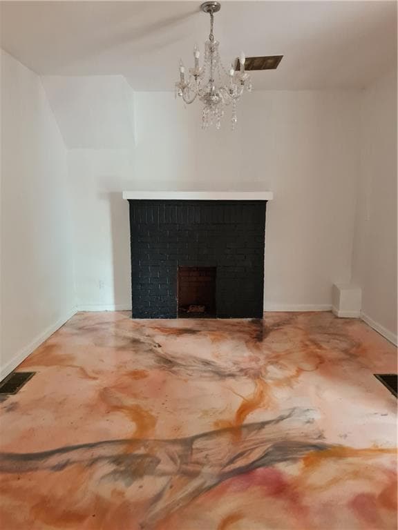 Detailed view of a chandelier and a brick fireplace