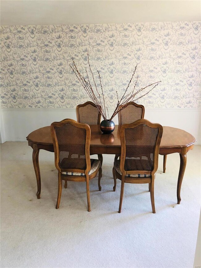 The dining room is located off of the foyer.